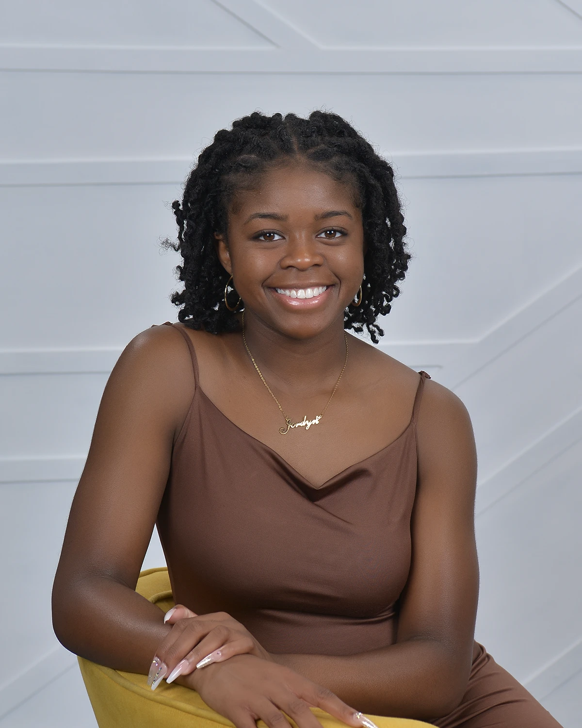 Portrait of woman in brown dress