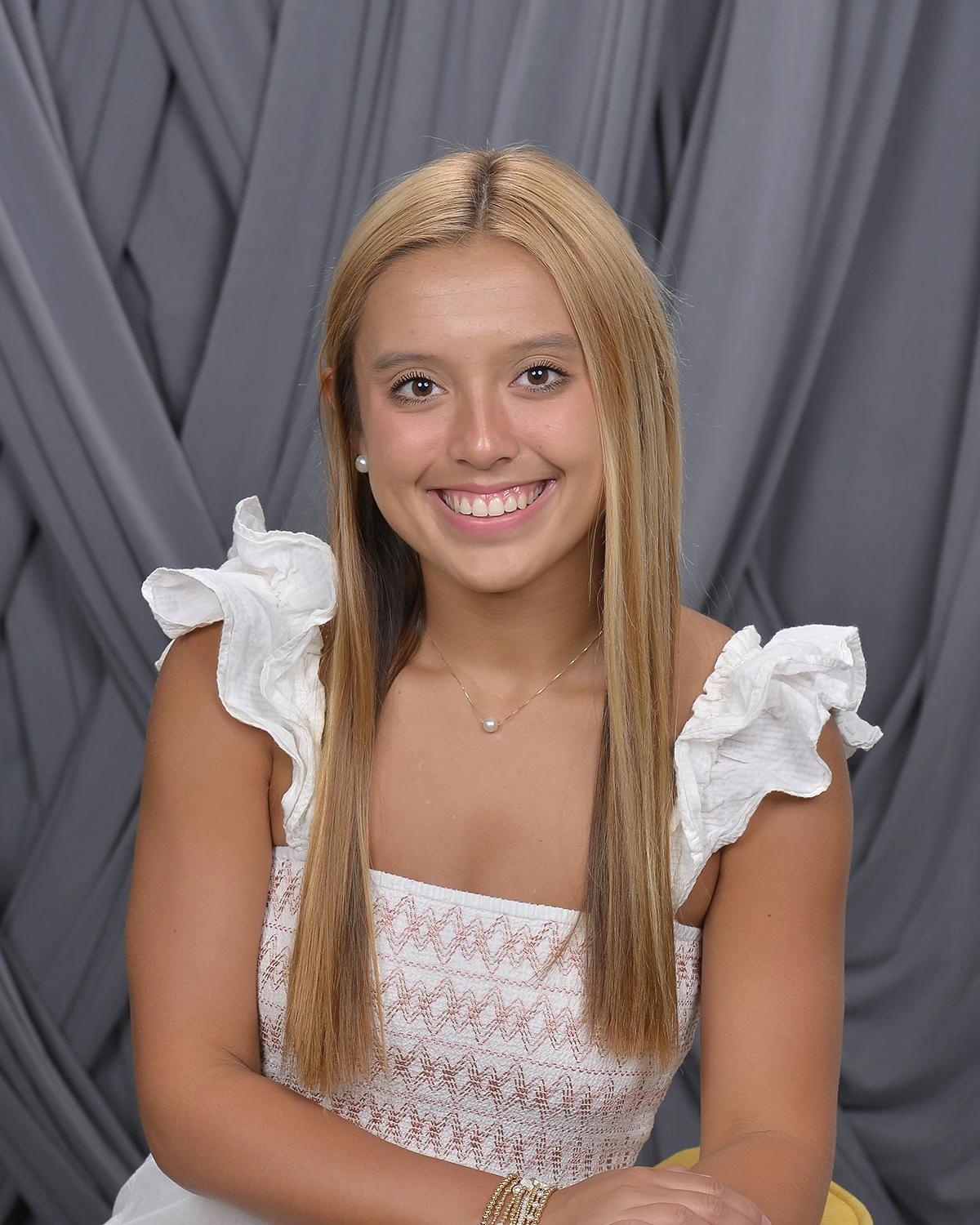 Casual portrait of young woman in white dress