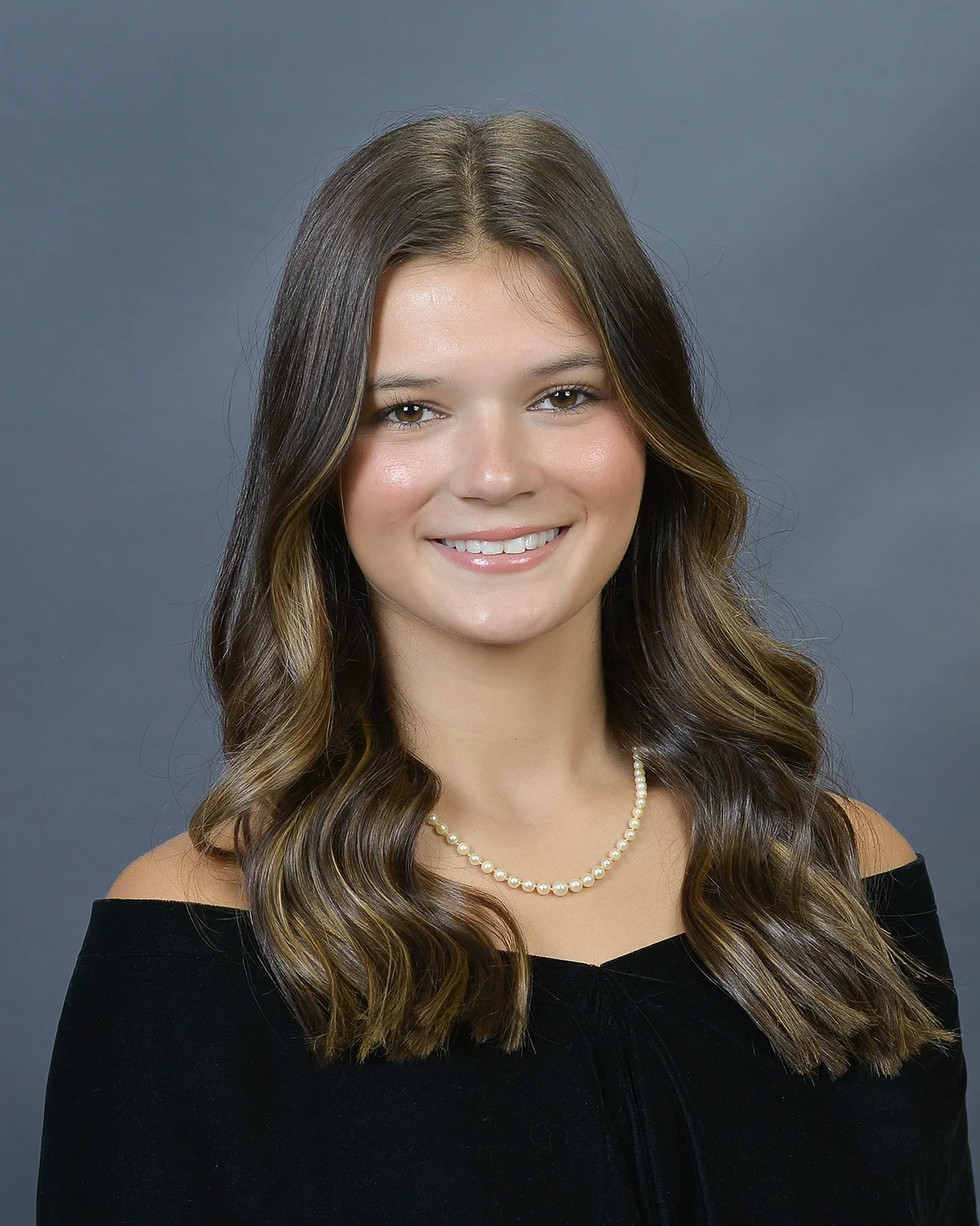 Senior portrait of woman in formal attire