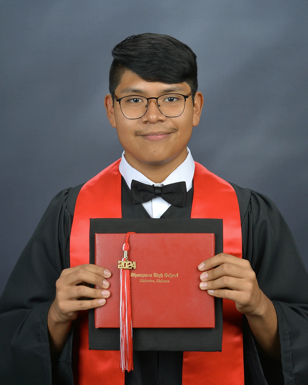 Senior portrait of man holding diploma