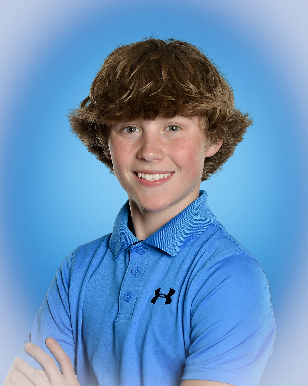 Portrait of boy on blue background